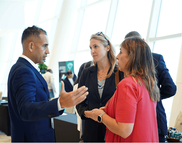 Attendees networking in hallway
