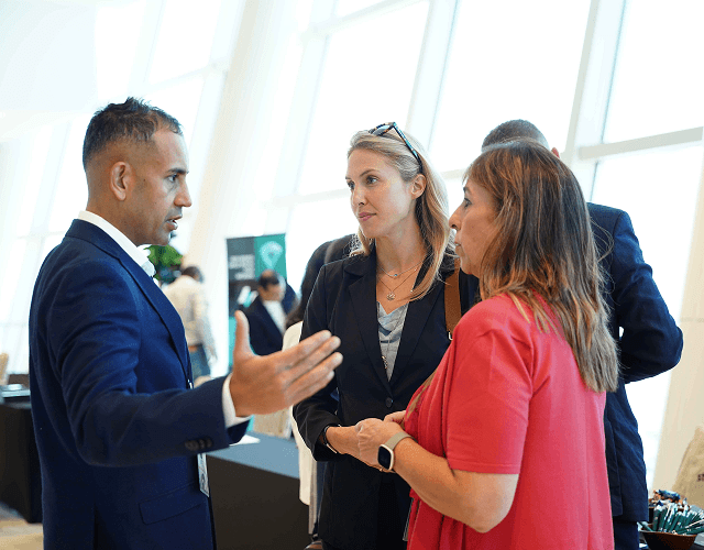 Attendees networking in hallway
